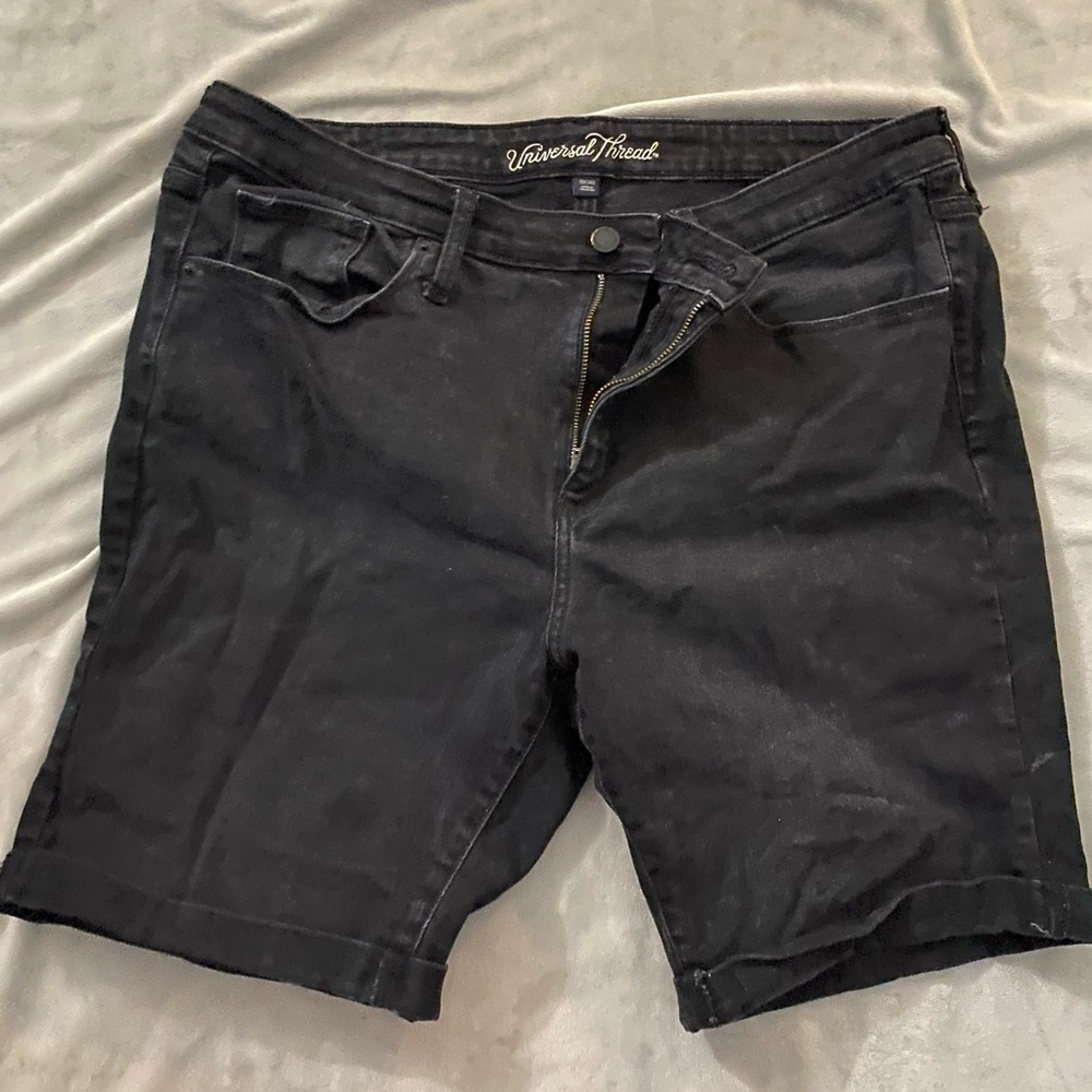 Women’s Bermuda length distressed black jean shorts